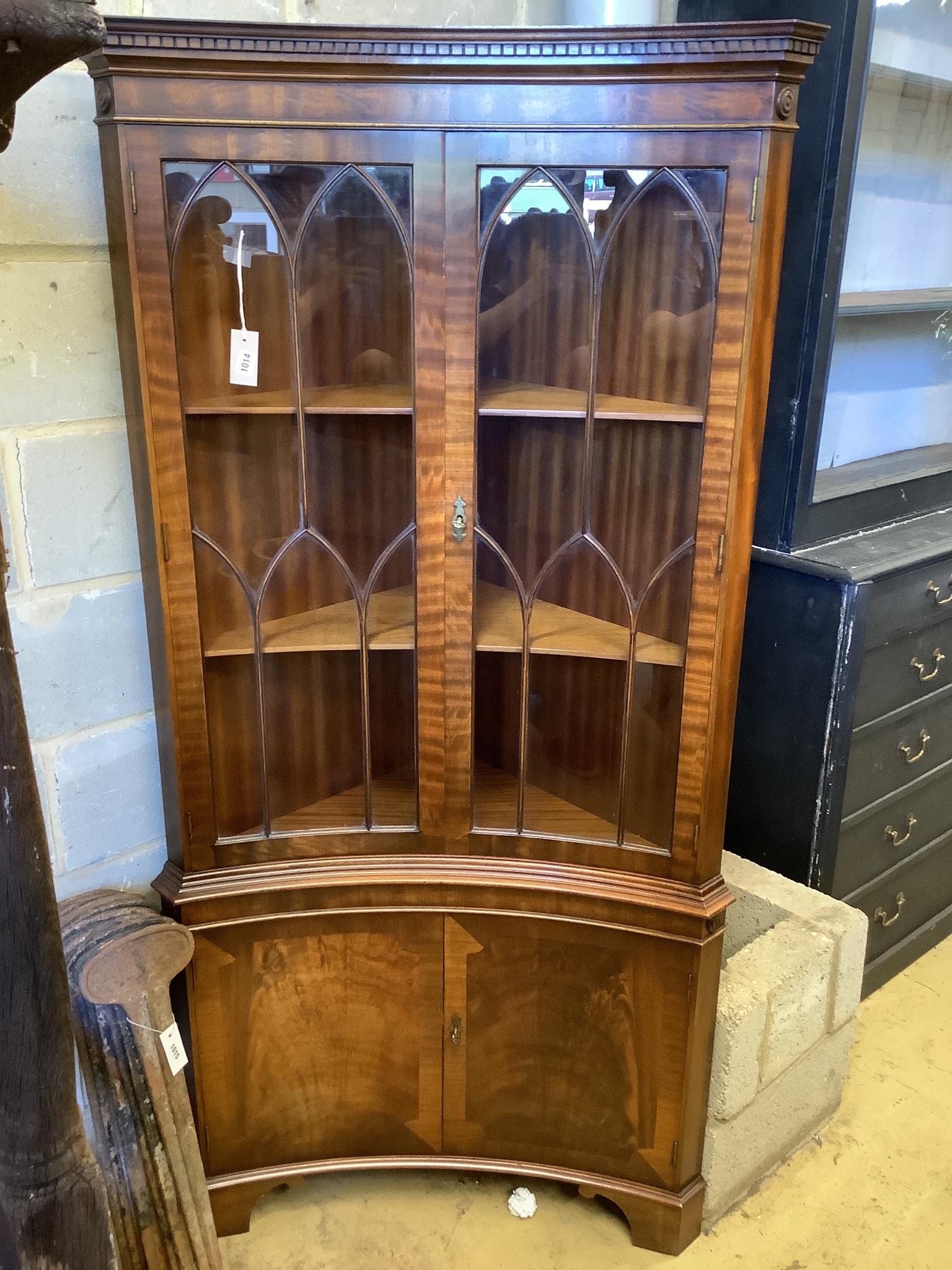 A Georgian style mahogany floor-standing corner display cabinet